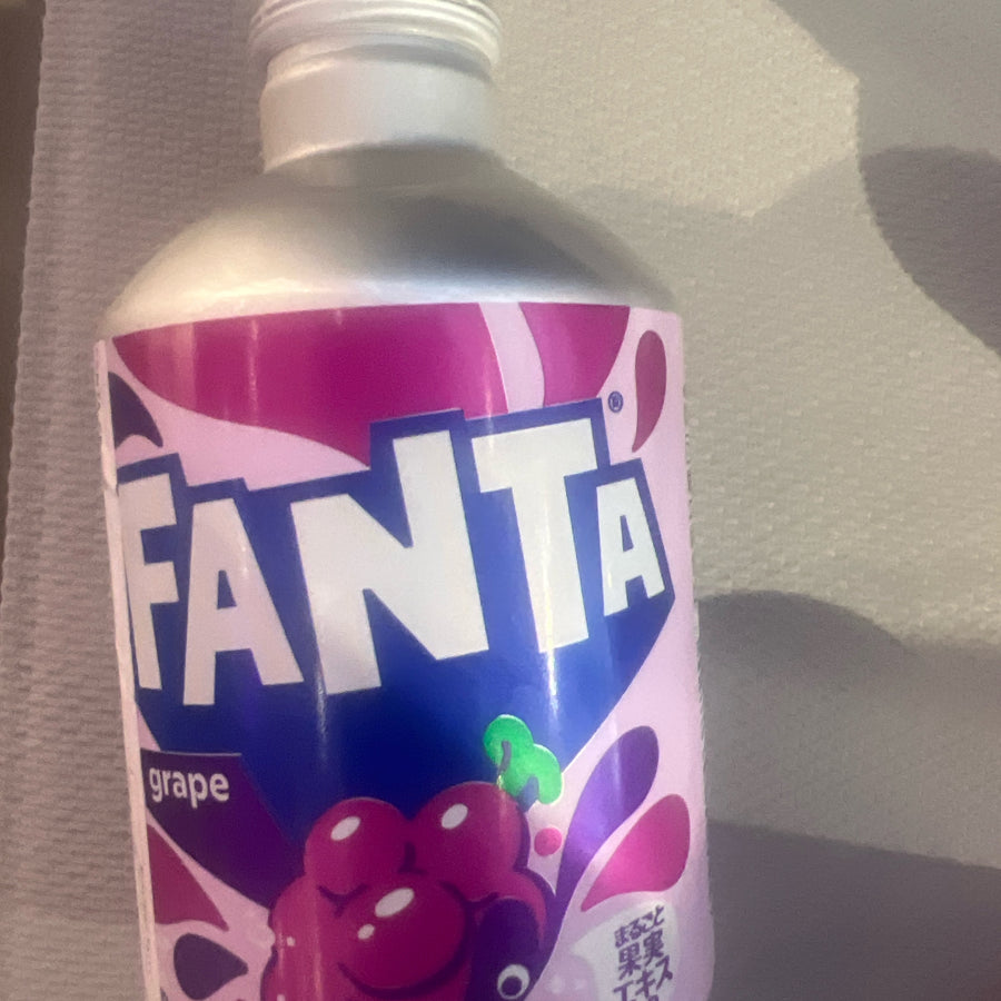 Fanta Grape Flavored Soft Drink from Japan 300ml / 11 fl oz Can (24) — front of pack at Exotic Snaxx Chicago