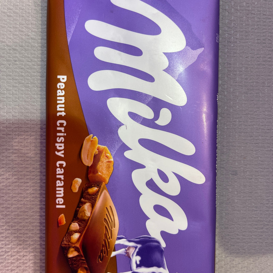 Milka Peanut Crispy Caramel ( Romania ) — front of pack at Exotic Snaxx Chicago