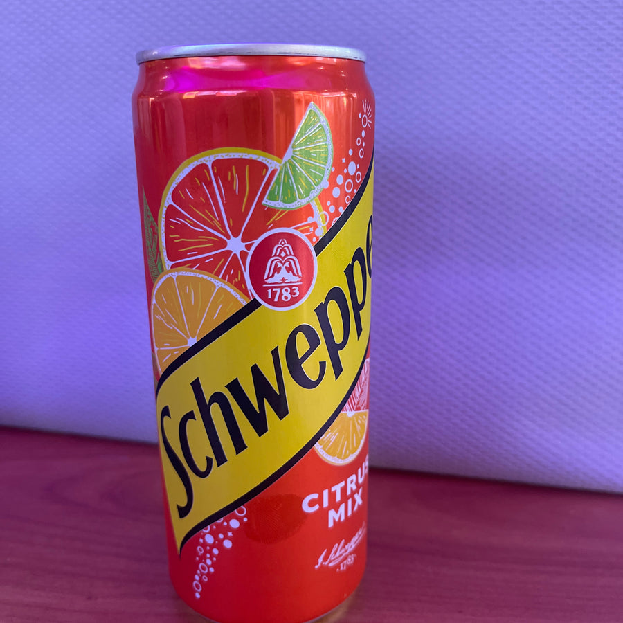 Schweppes Citrus Mix (Poland, 330 ml) — front of pack at Exotic Snaxx Chicago