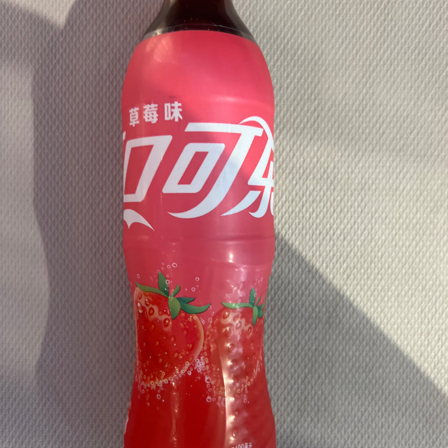 Coca-Cola Coke Strawberry Flavored Soft Drink Soda 500 ml / 17 fl oz Each bottle (12) — front of pack at Exotic Snaxx Chicago